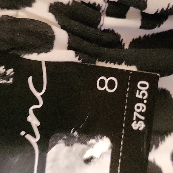 *NWT Inc. Emerald Asymmetrical Giraffe Print Mid Rise Lined Skirt. - Picture 6 of 11